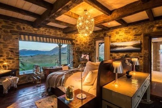 Premium room with king bed, sitting area and panoramic alpine vista